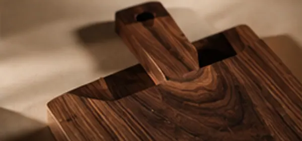 A cutting board handle in low light